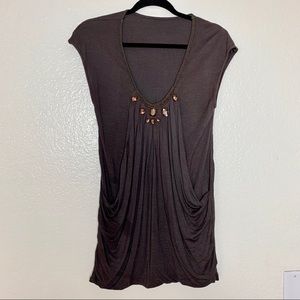 Embellished pleated short sleeve dress.